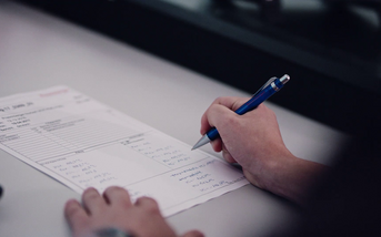 person writing notes